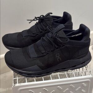 On Cloud Running Black Athletic Shoes with Streamlined Design